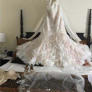 This dress was worn one day and was dry cleaned and boxed and never worn again.